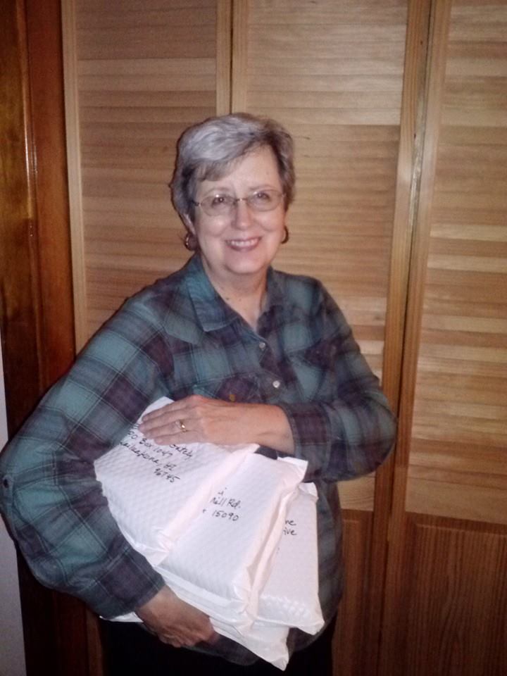 Karen holding Goodreads giveaway packages